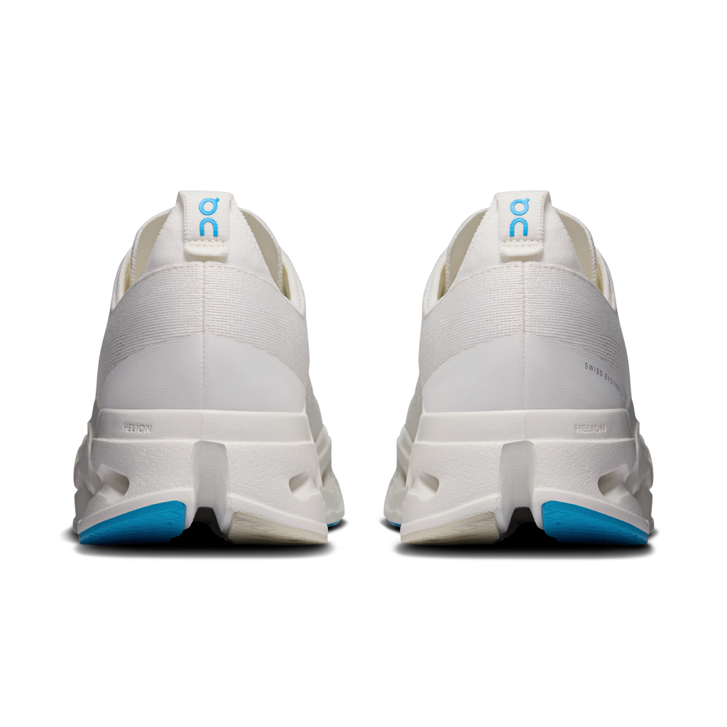 Back view of men's white running shoes with heel padding and blue trim