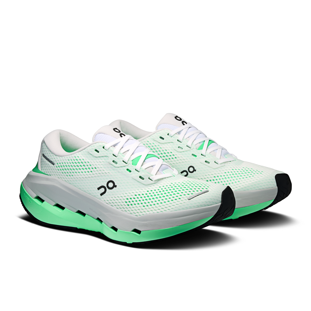 Women's running shoes, white mesh sneaker with green laces and black heel panel