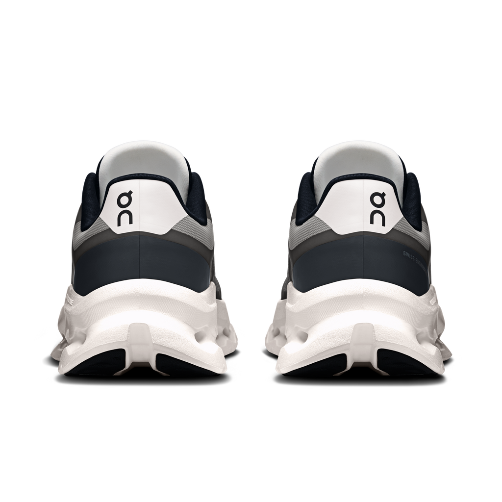 Back view of men's black and ivory running shoes with heel collar and rear cushioning