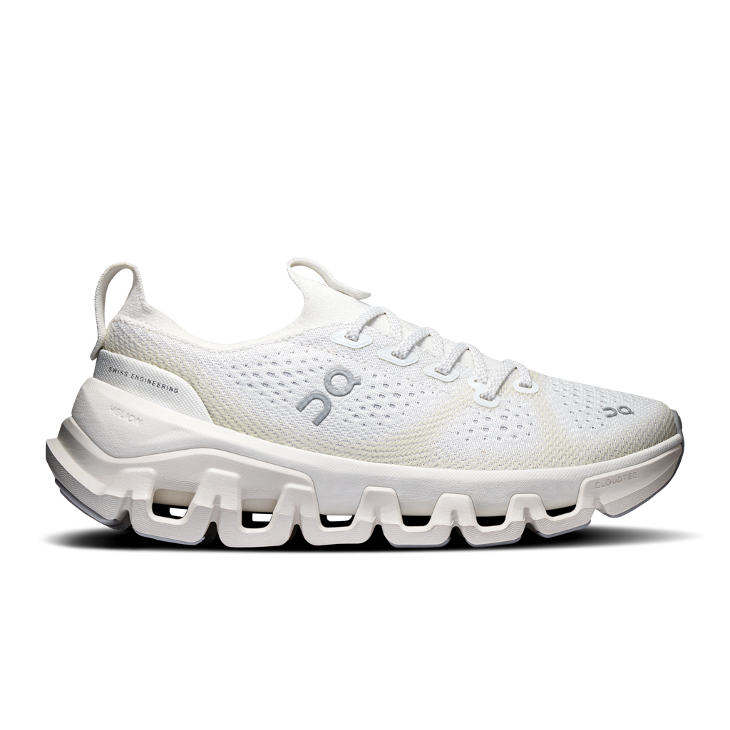 Women's ivory running shoes with white cloud-style sole, lace-up knit upper