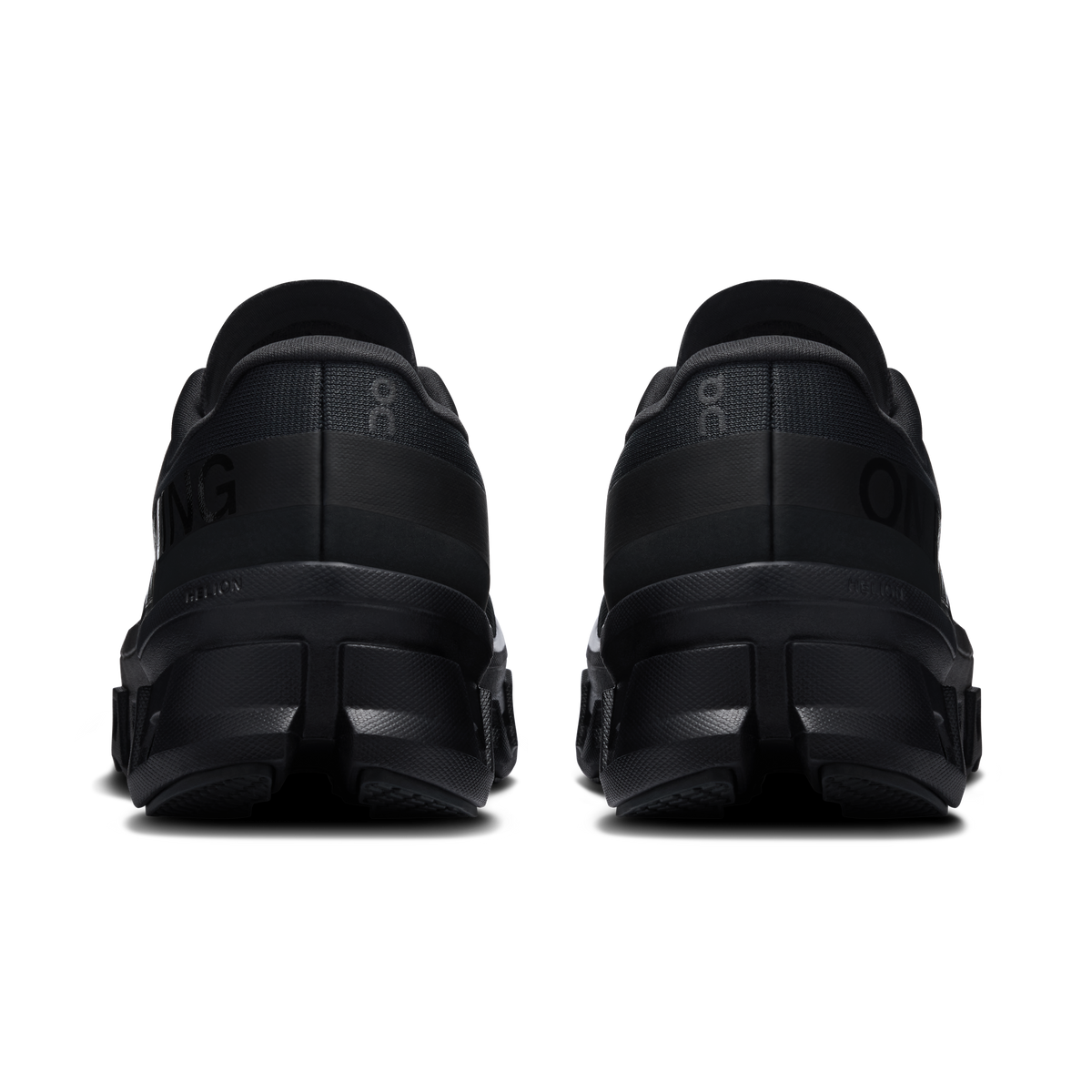 On Cloudmonster 1 women's black running shoes, heel view with padded back and midsole.