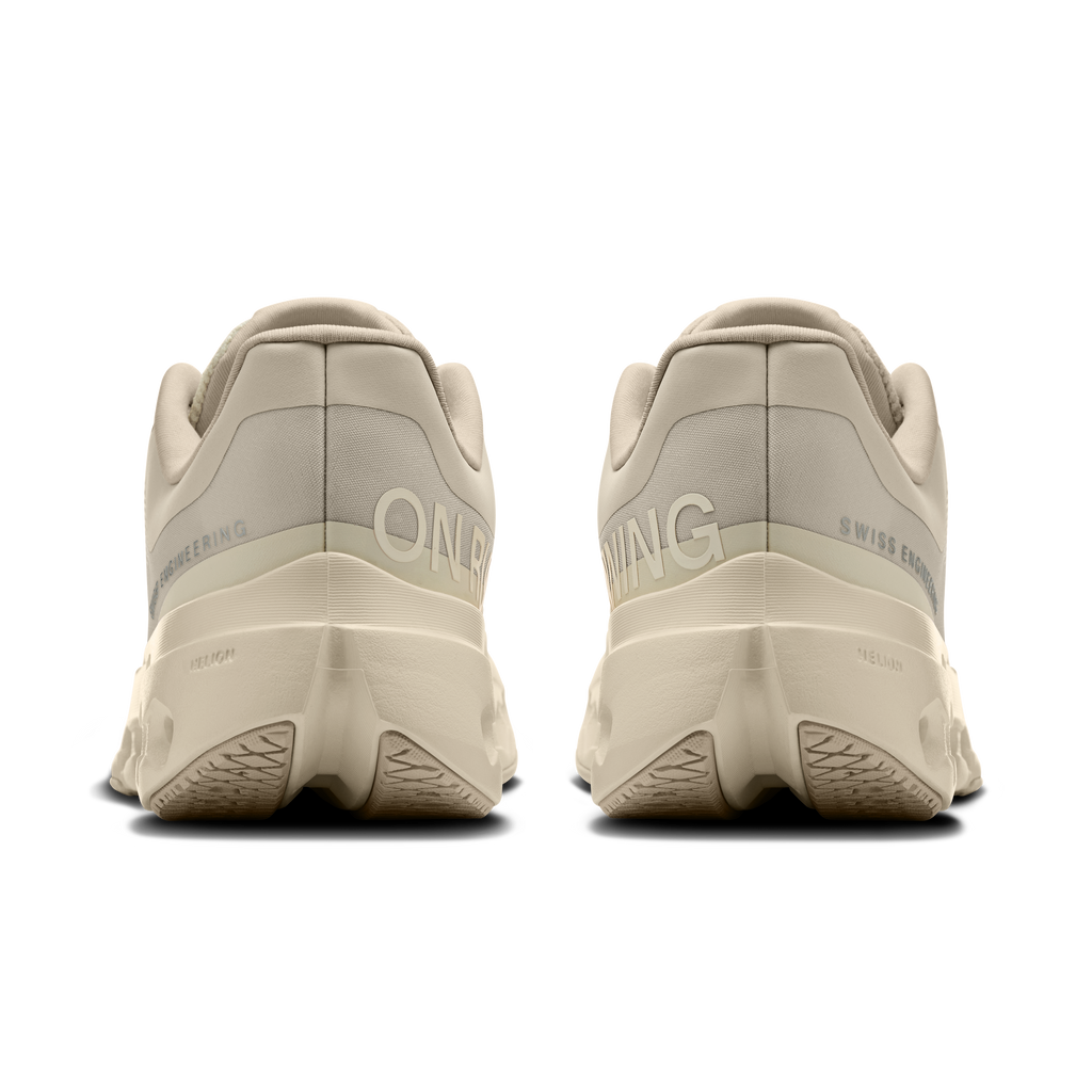 Women's running shoes, back view with heel branding and light beige cushioned sole