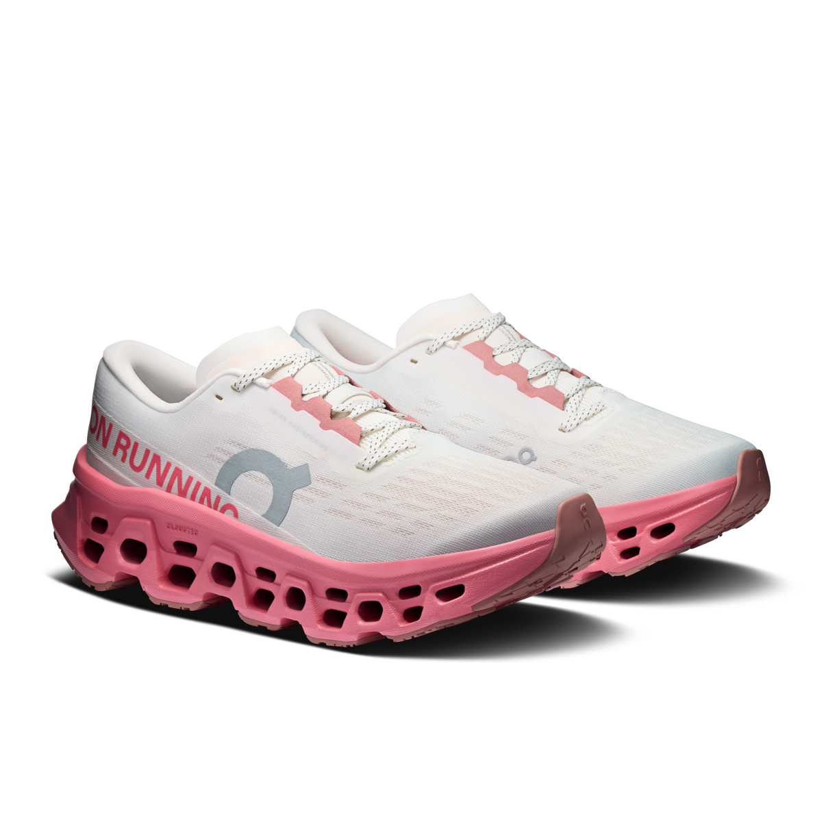 Ivory women's running shoes with pink sidewall and lace-up mesh upper
