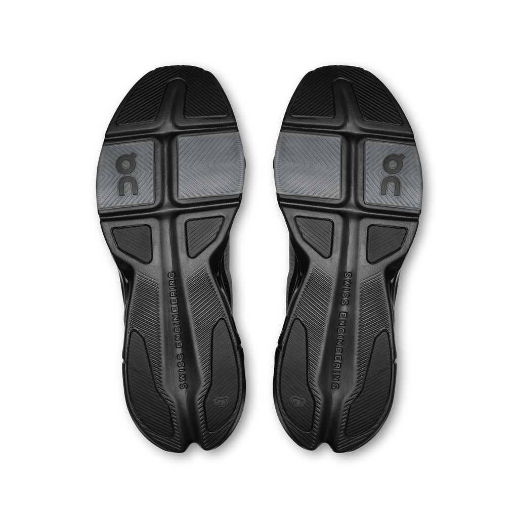 Pair of black rubber outsoles with multi-traction tread and On logo