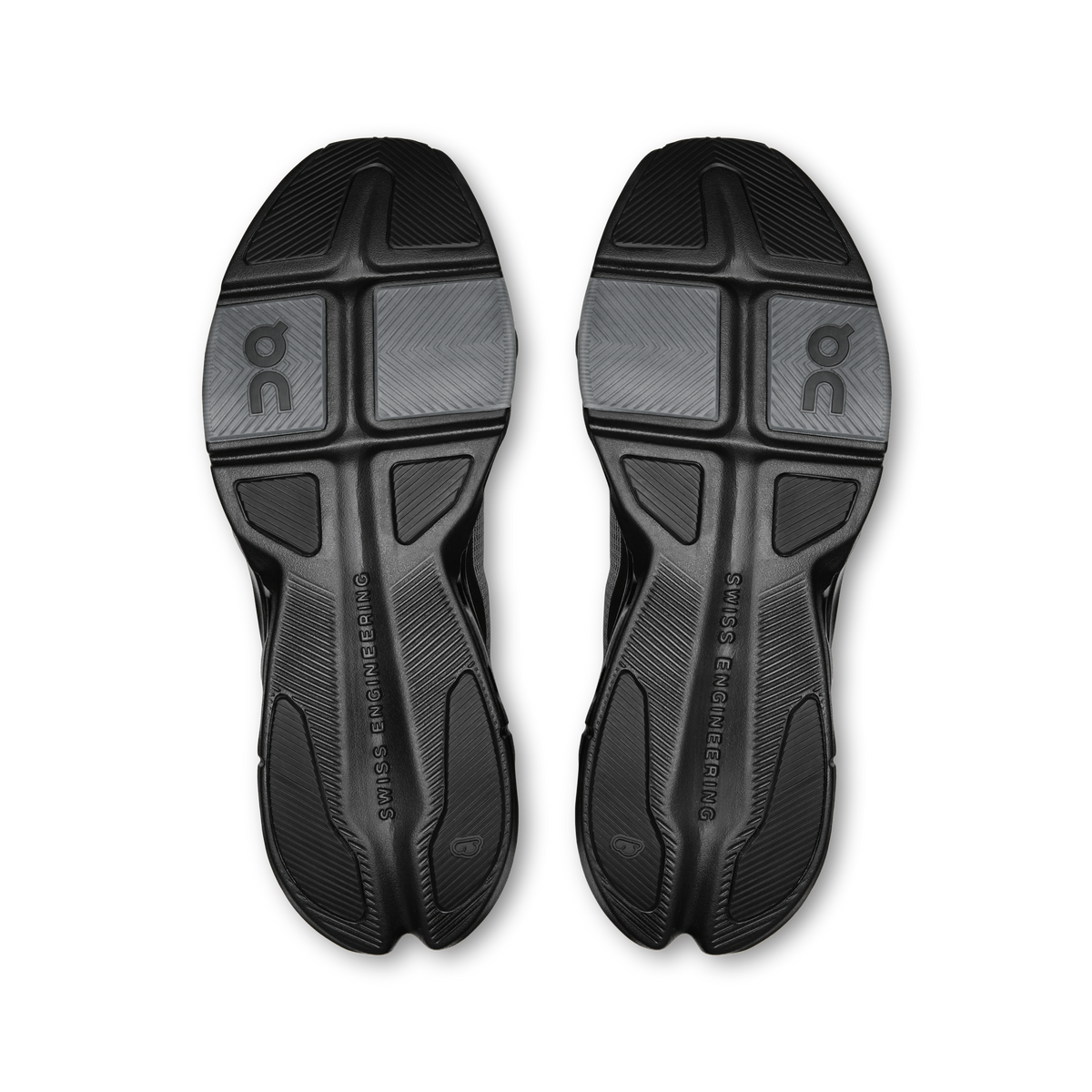 Pair of black rubber outsoles with multi-traction tread and On logo