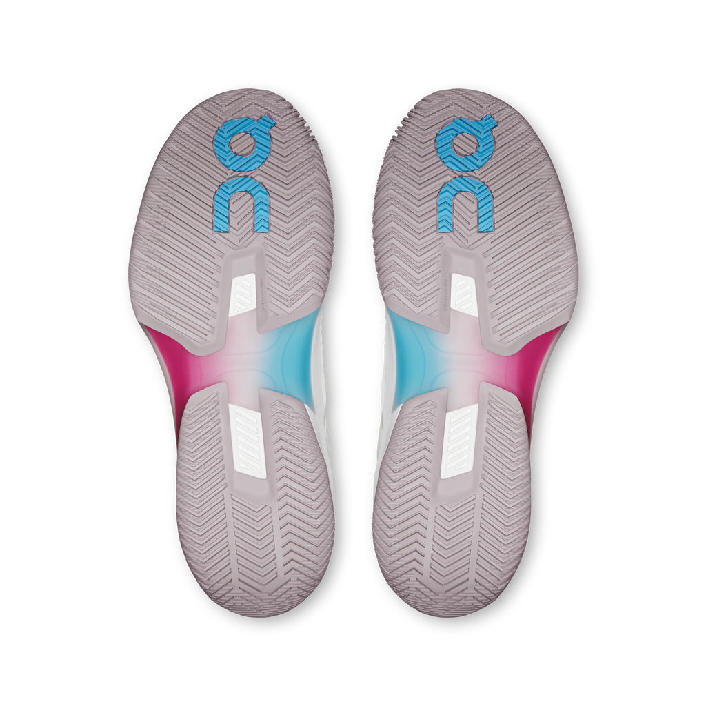 Pair of shoe outsoles with chevron traction, white with pink and blue accents