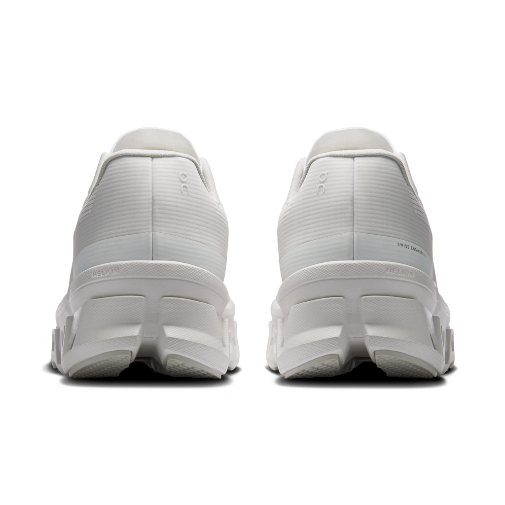 Women's white running shoes rear view with cushioned heel and pull tab