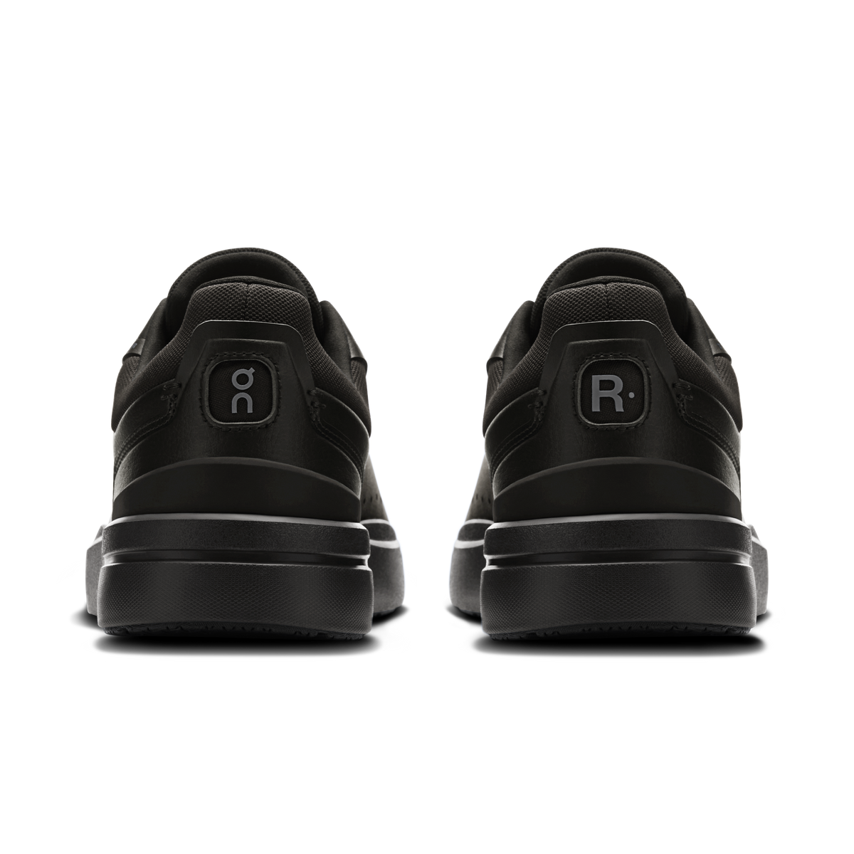 On men's black sneakers, heel view with On logo and rear R emblem