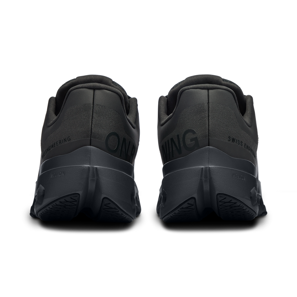 On Cloudsurfer Next running shoes, back view, black upper with padded collar