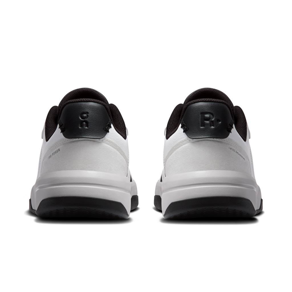 Back view of white and dark gray sneakers with heel loop and cushioned sole