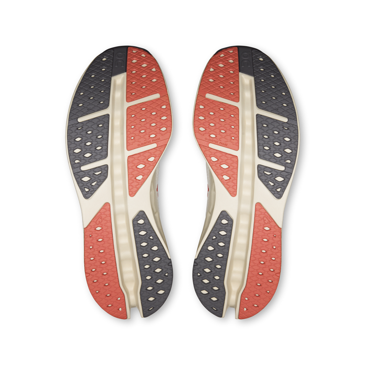 On Cloudsurfer Max shoe outsoles showing red and gray traction patterns on both soles