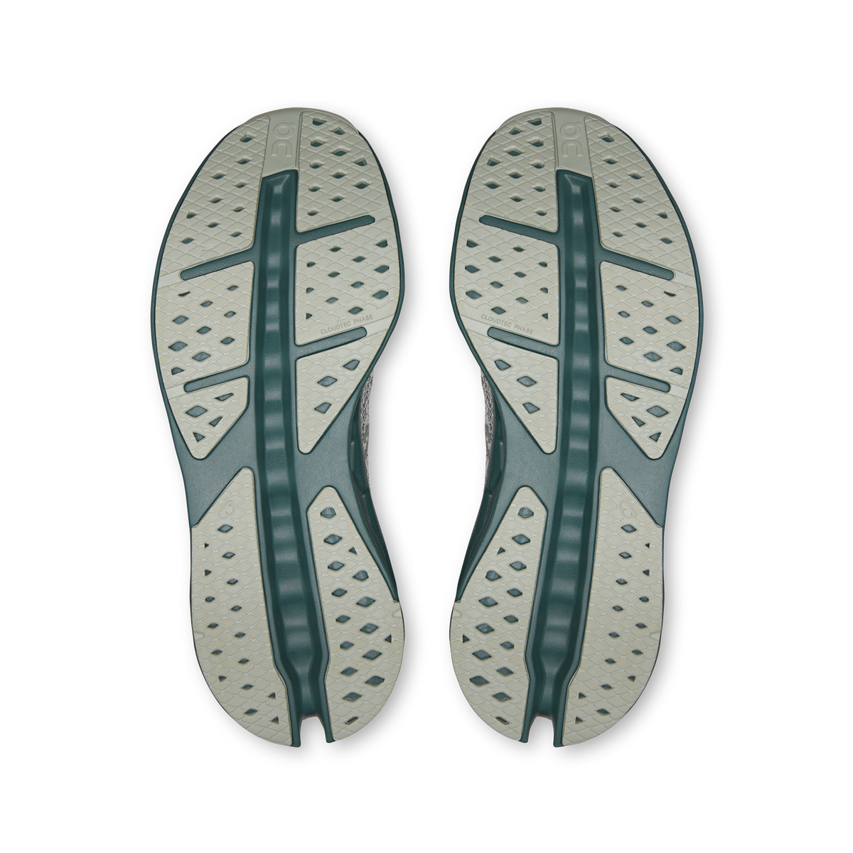 Shoe outsole view with textured tread and teal center support stripe