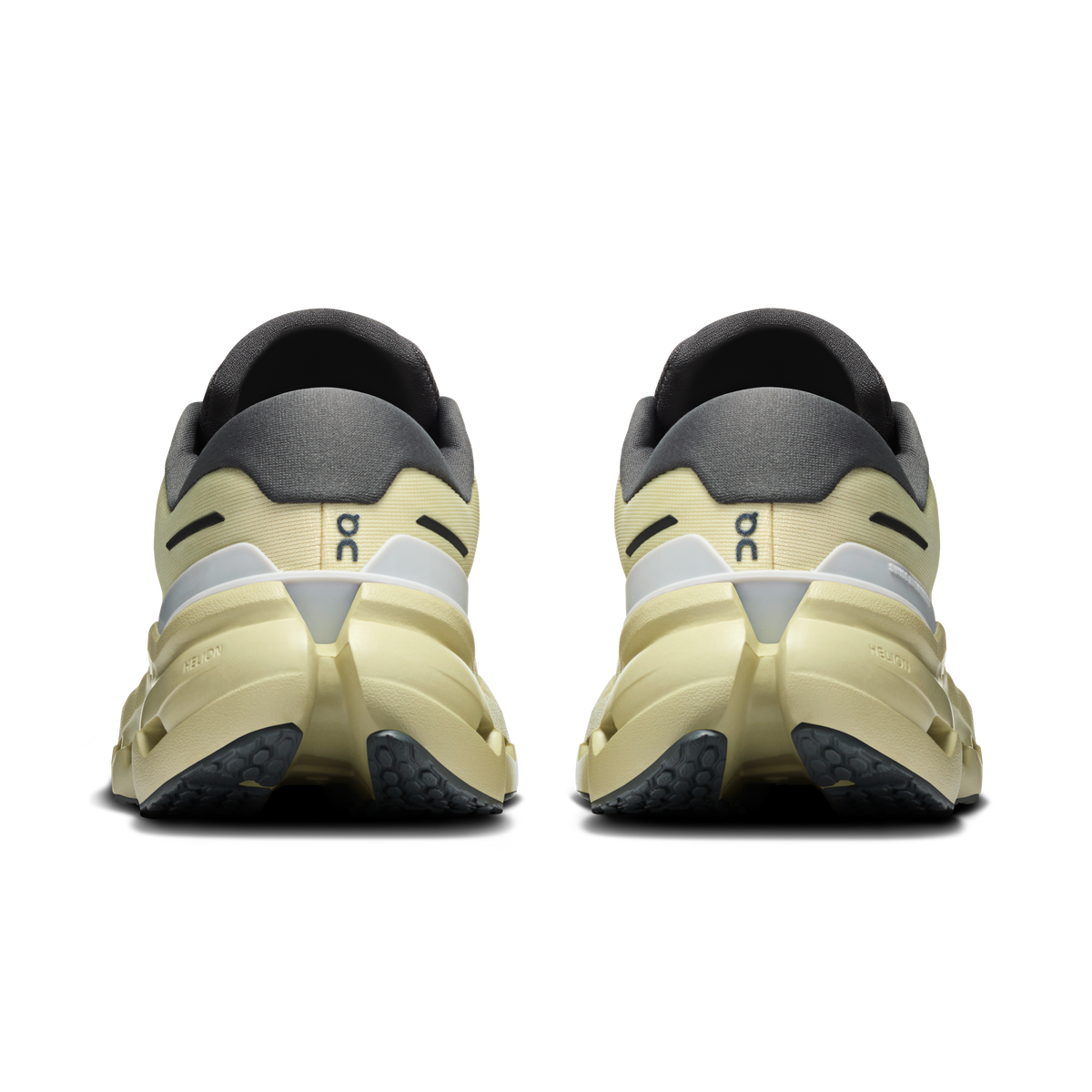 Women's waterproof running shoes, pale yellow heel with dark gray collar and lace closure.