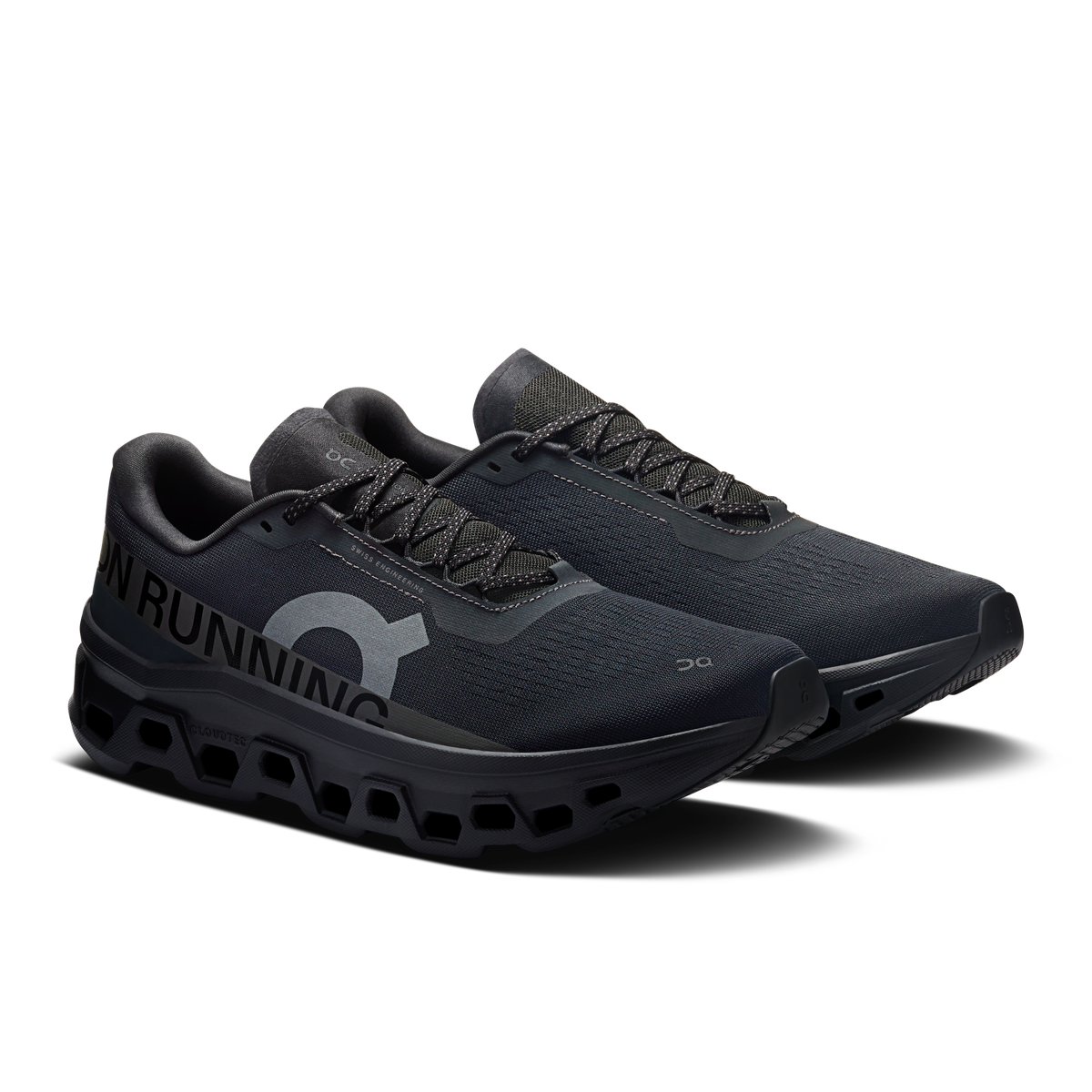 Men's black running shoes, three-quarter view, lace-up upper with textured sole pods