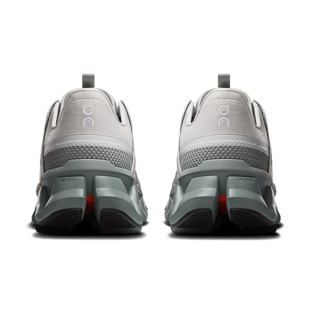 Back view of men's On Running Cloudswift Amp shoes with gray heel counters and red details