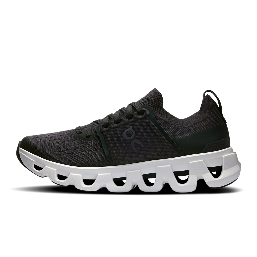 Women's running shoes, black mesh upper, lace-up front, white segmented cushioned sole