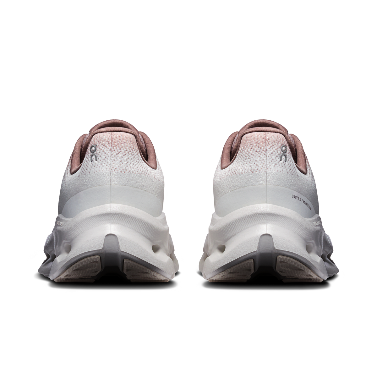 Women’s running shoes back view in ivory with pink heel collar and molded heel