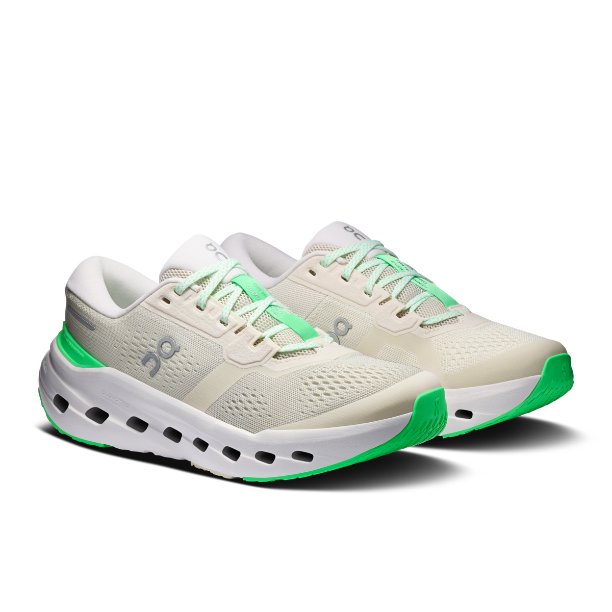 Women's running shoes, cream upper with green laces and white perforated midsole