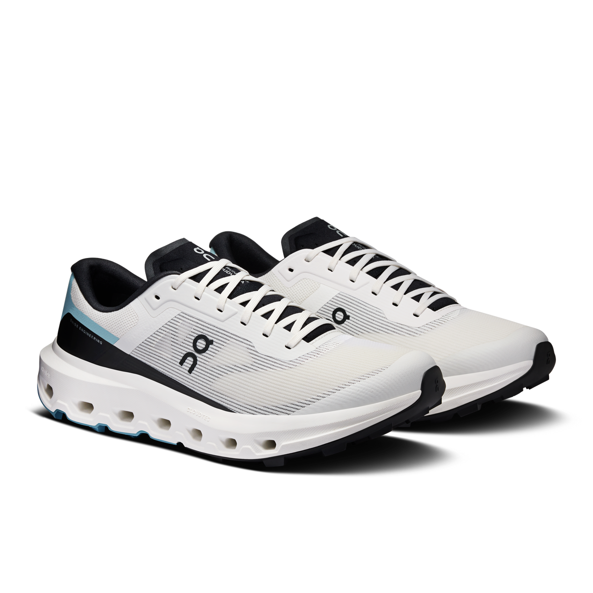 Men's lace-up running shoes, ivory upper with black heel and blue trim, angled view