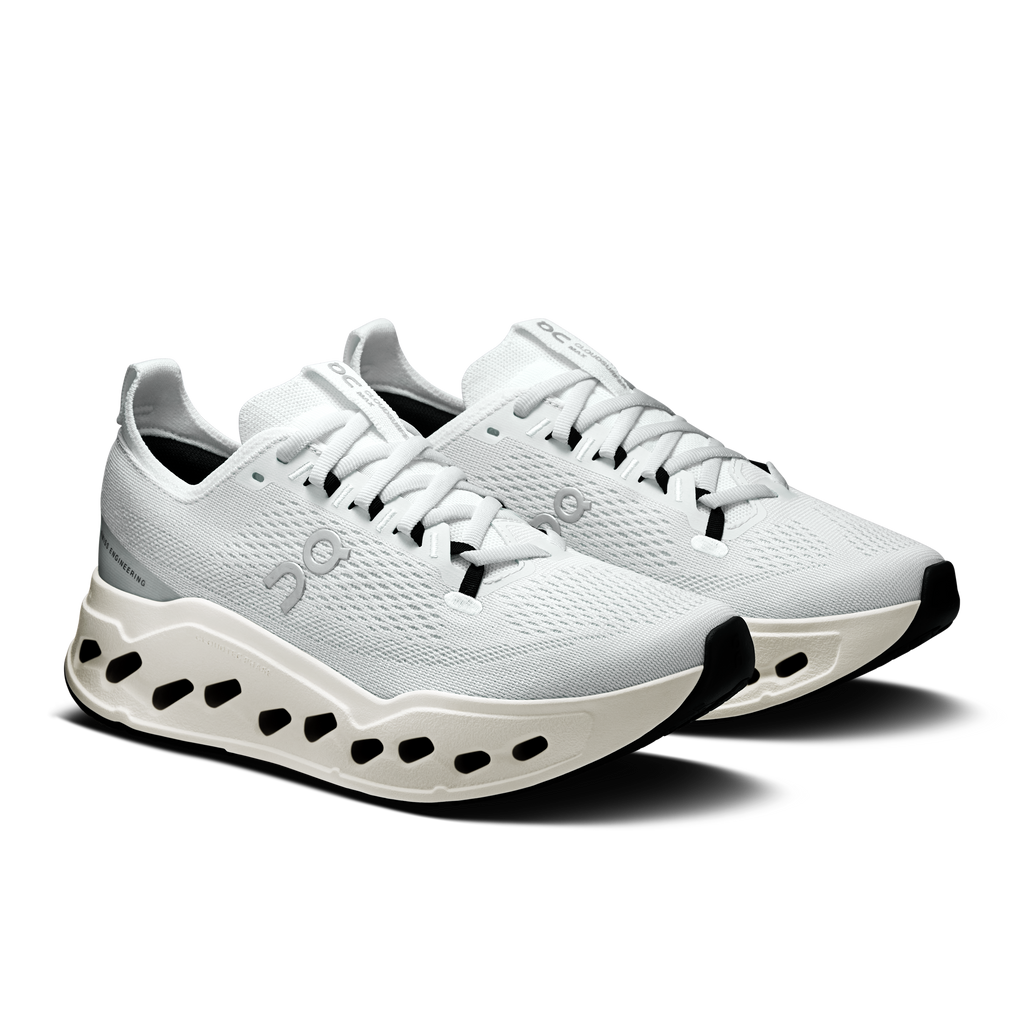 On women’s white lace-up running shoes with CloudTec pod midsole, pair view