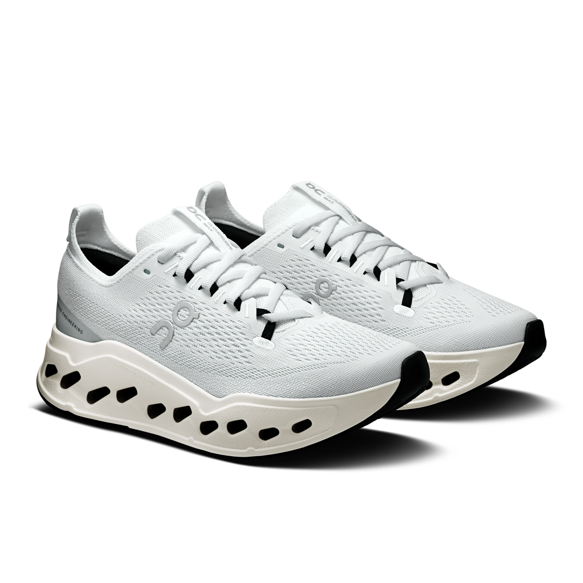 On women’s white lace-up running shoes with CloudTec pod midsole, pair view