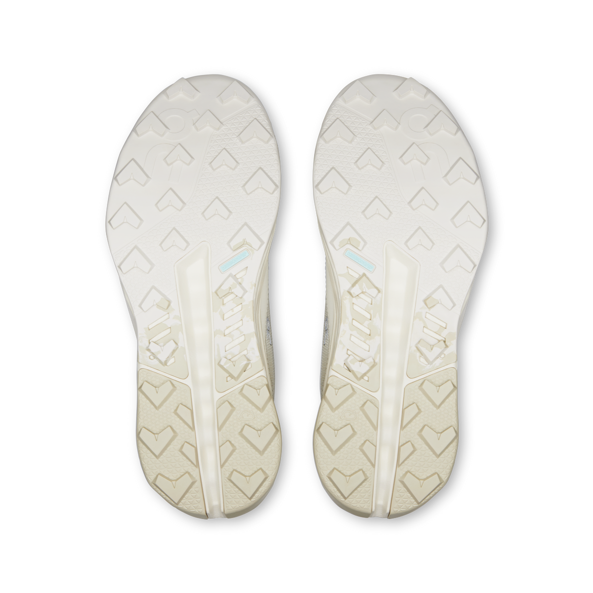 Pair of shoe outsoles with patterned tread, light ivory waterproof running shoes