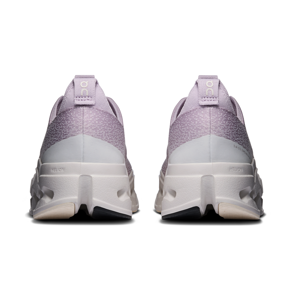 On Cloudsurfer Max wide shoes, rear view in lavender with white midsole cushioning