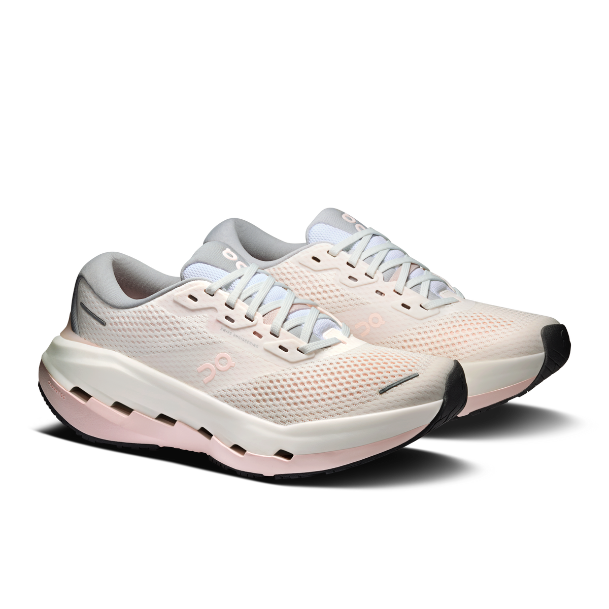 Pair of white running shoes with lace-up mesh uppers and cushioned foam midsole