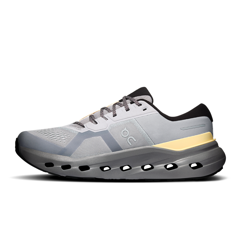 Men's running shoes, light gray upper with gold heel bar, black outsole pods