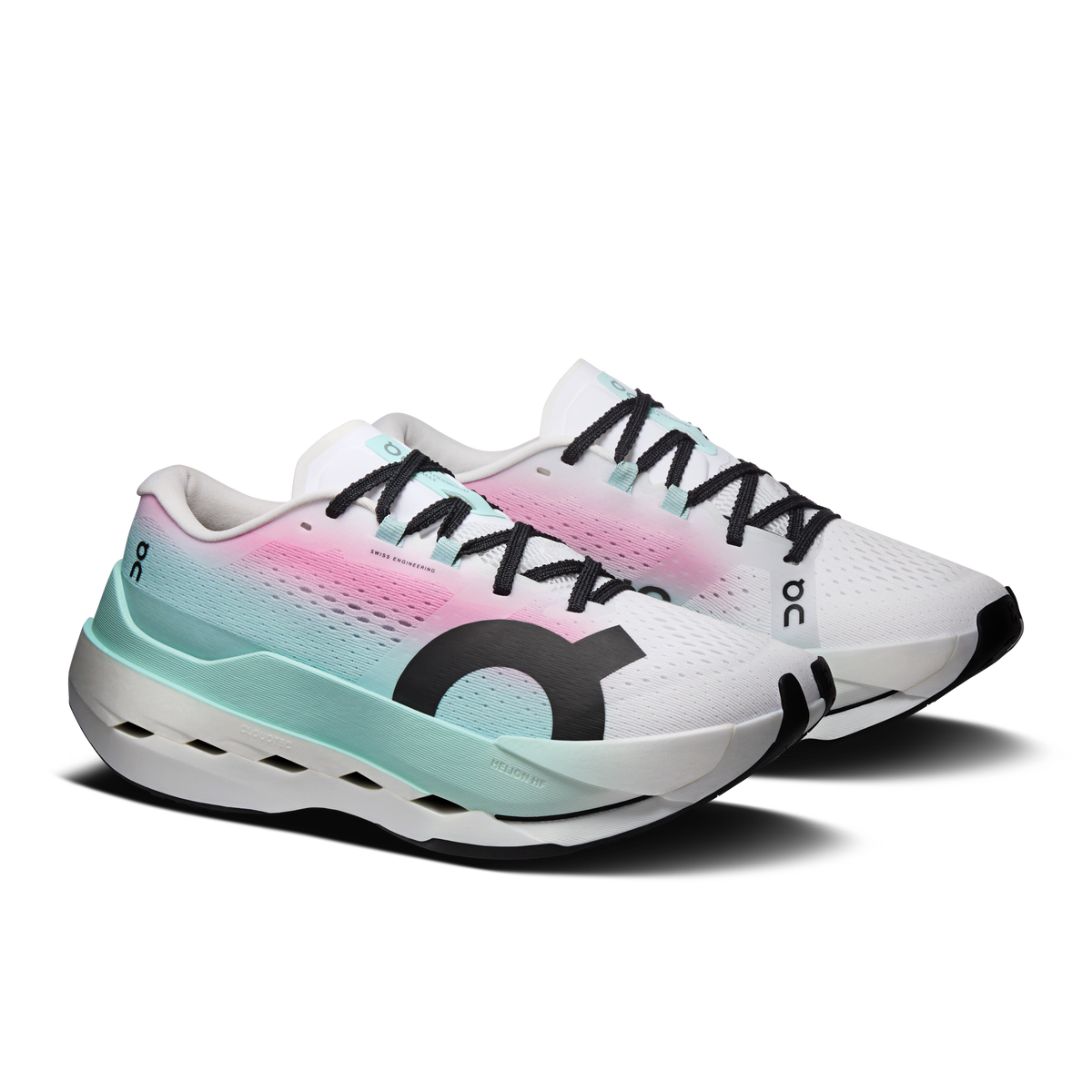 White running shoes with pink-to-teal gradient upper and black laces, side view