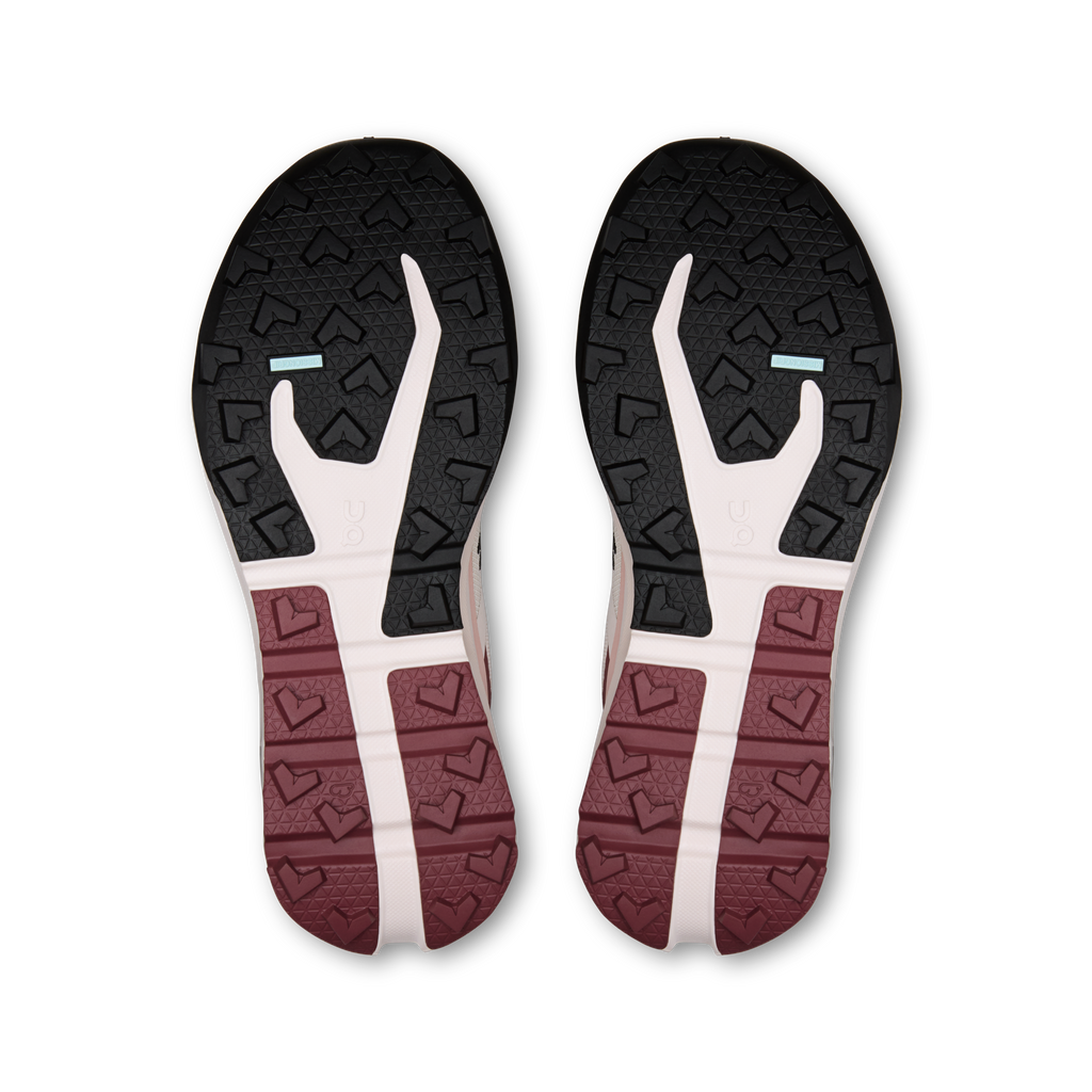 Shoe outsole with black tread, white logo area, and maroon textured stripe.