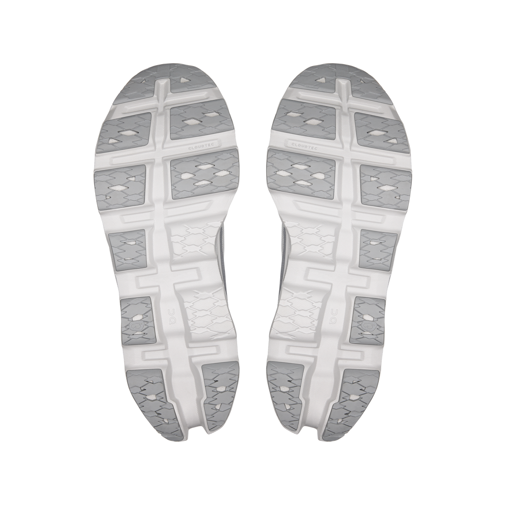 Men's running shoe outsoles showing patterned traction and molded cushioning pods