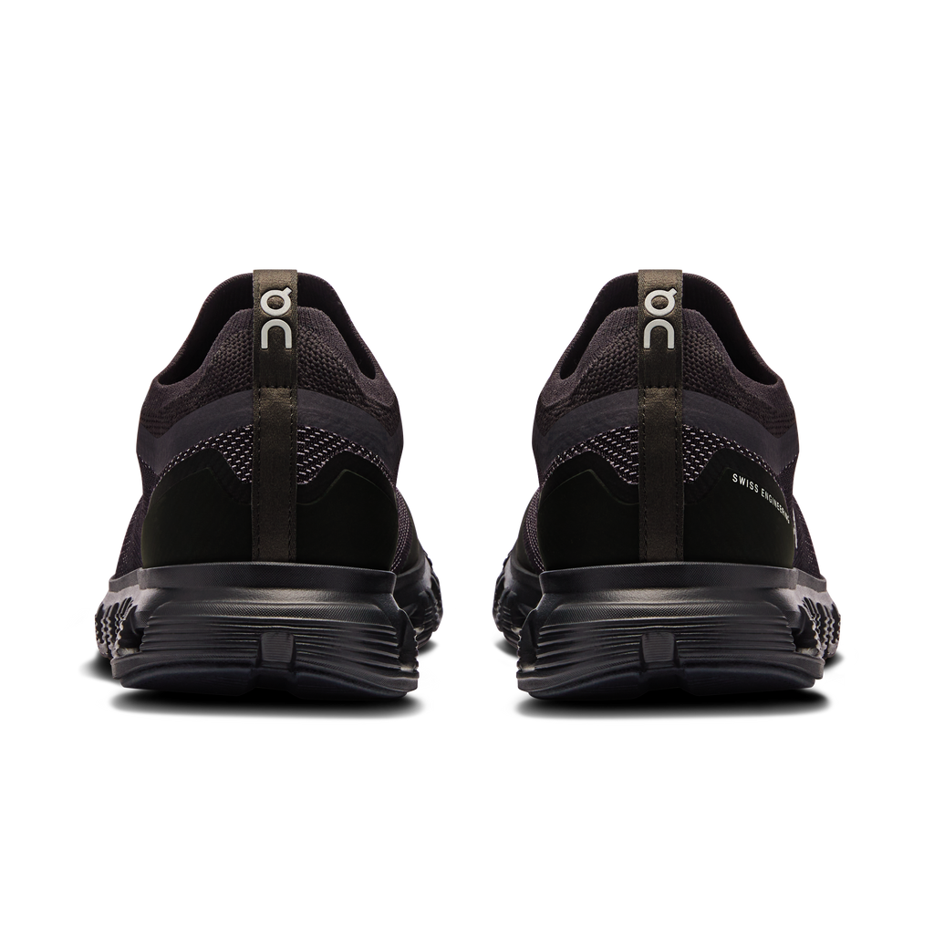Women\u2019s black running shoes, heel view with pull tab and cushioned midsole