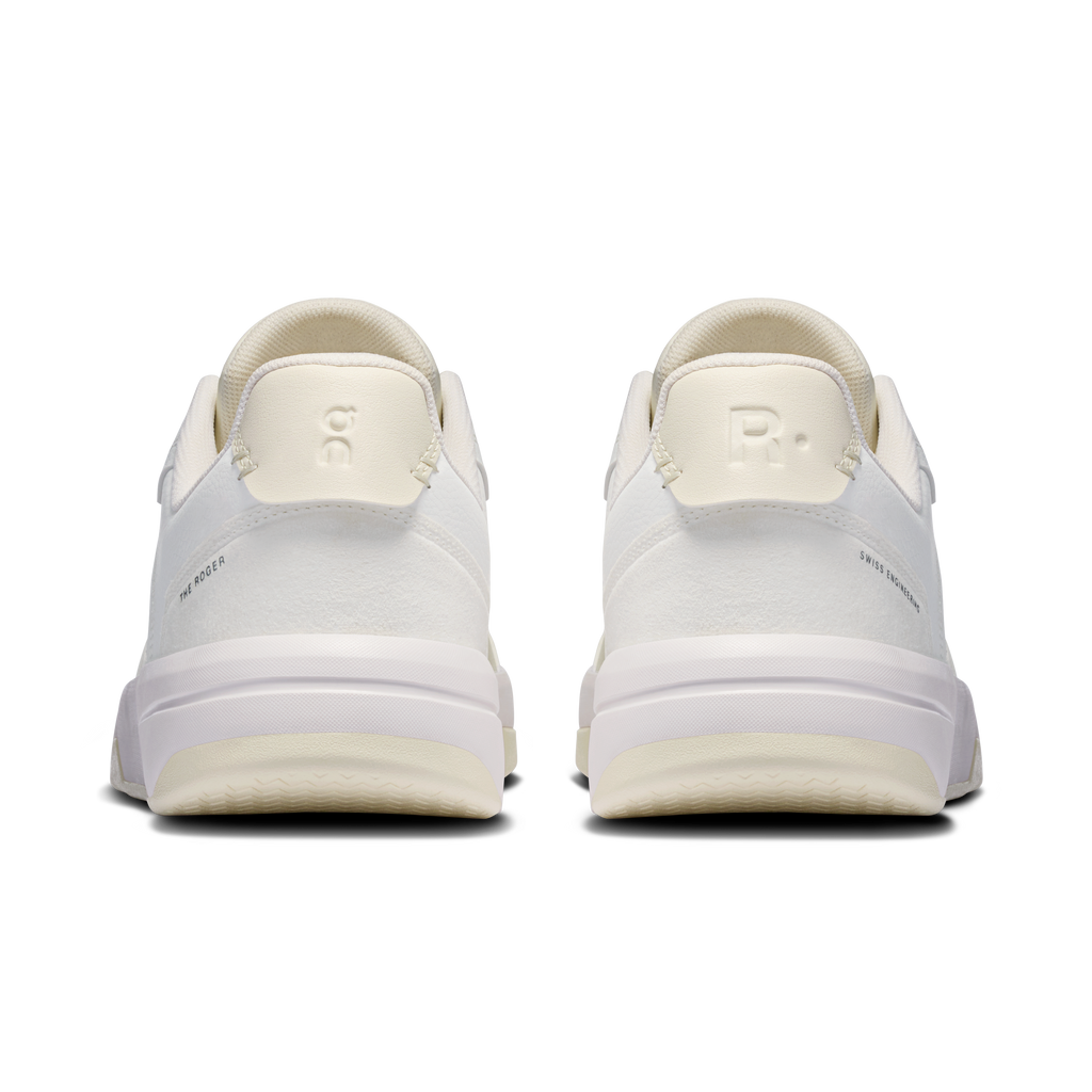 Men's white sneakers with cushioned heel, rear pull tabs, and logo detail