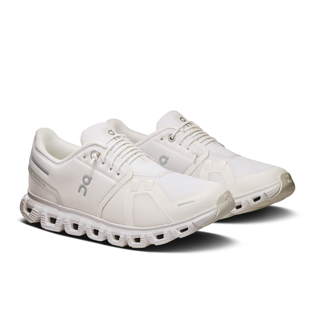 Women's white wide lace-up running shoes with padded tongue and On logo