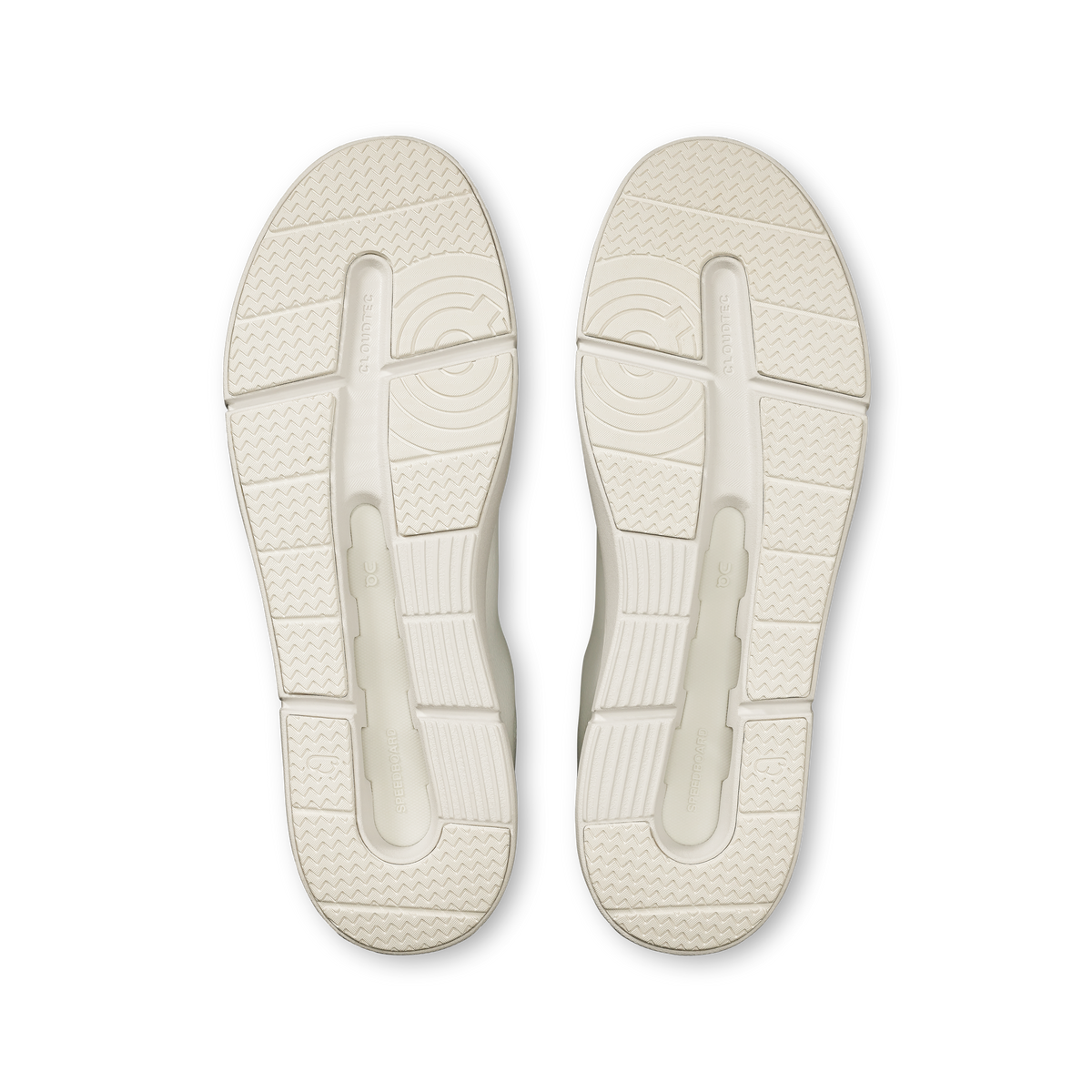 Pair of white shoe soles with molded traction pattern and heel cushioning