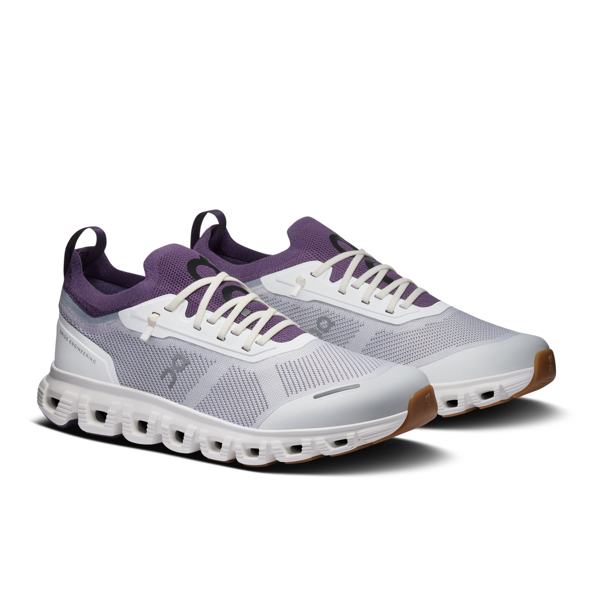Pair of ivory and dark purple knit running shoes with lace-up front and CloudTec sole
