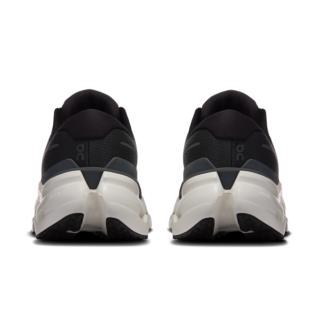 Men's black running shoe heel with white midsole and padded rear collar