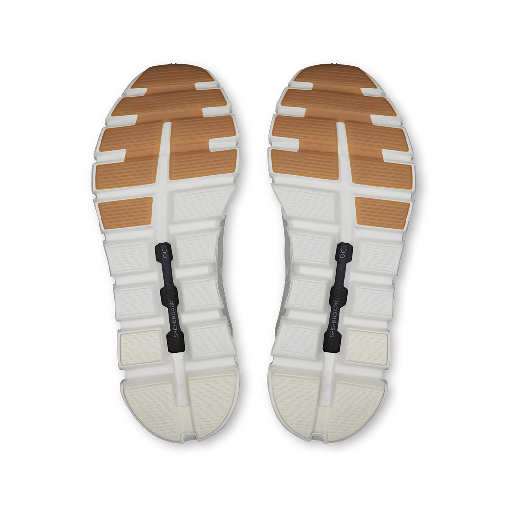 Pair of shoe outsoles, white with brown rubber tread and On Cloud cushioning