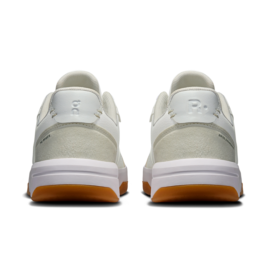 On women's white and ivory sneakers with cushioned heel and rear logo