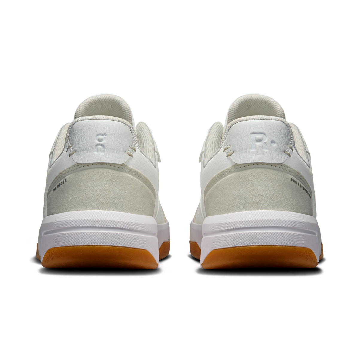 On women's white and ivory sneakers with cushioned heel and rear logo