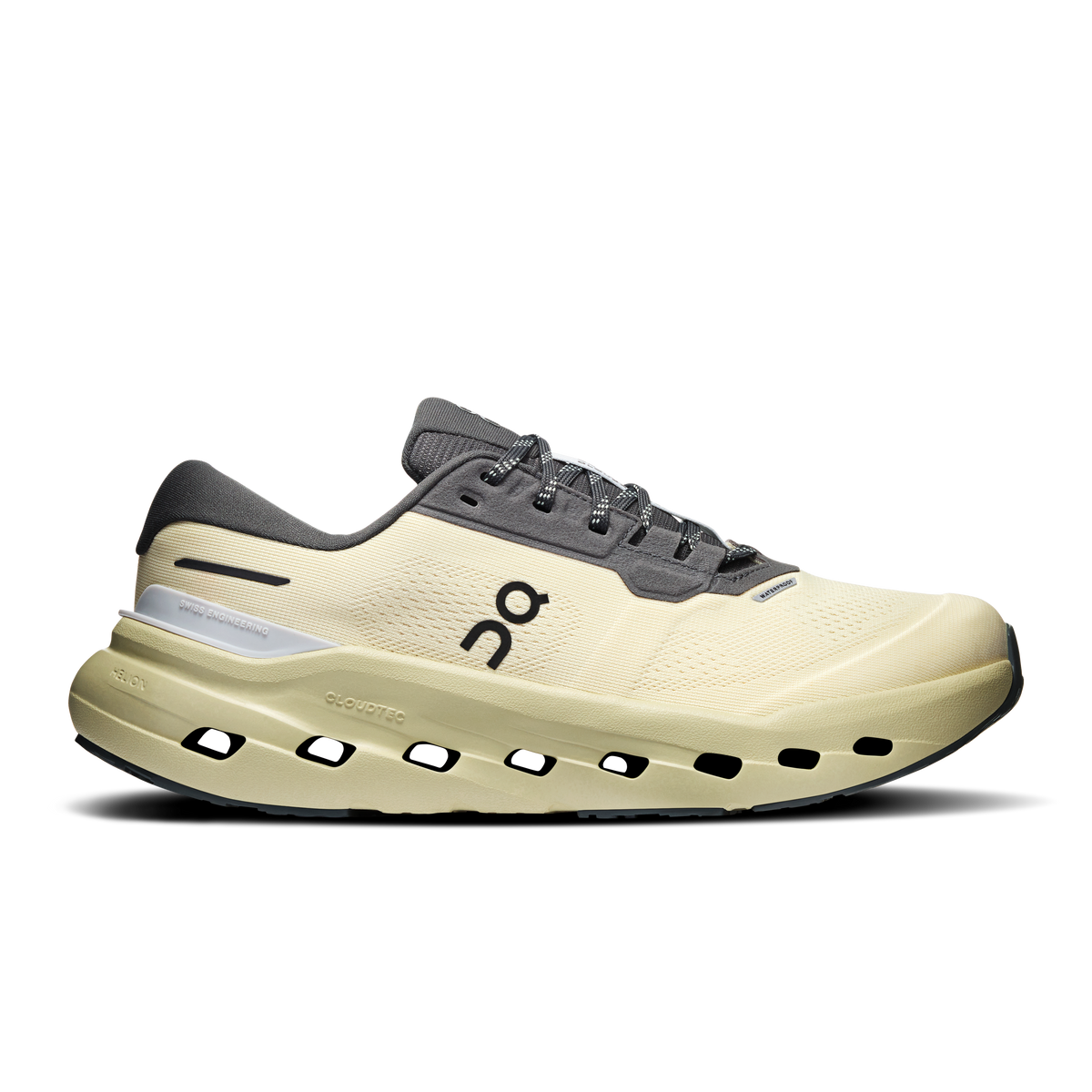 Women's waterproof running shoes in pale yellow with dark gray lace-up uppers.
