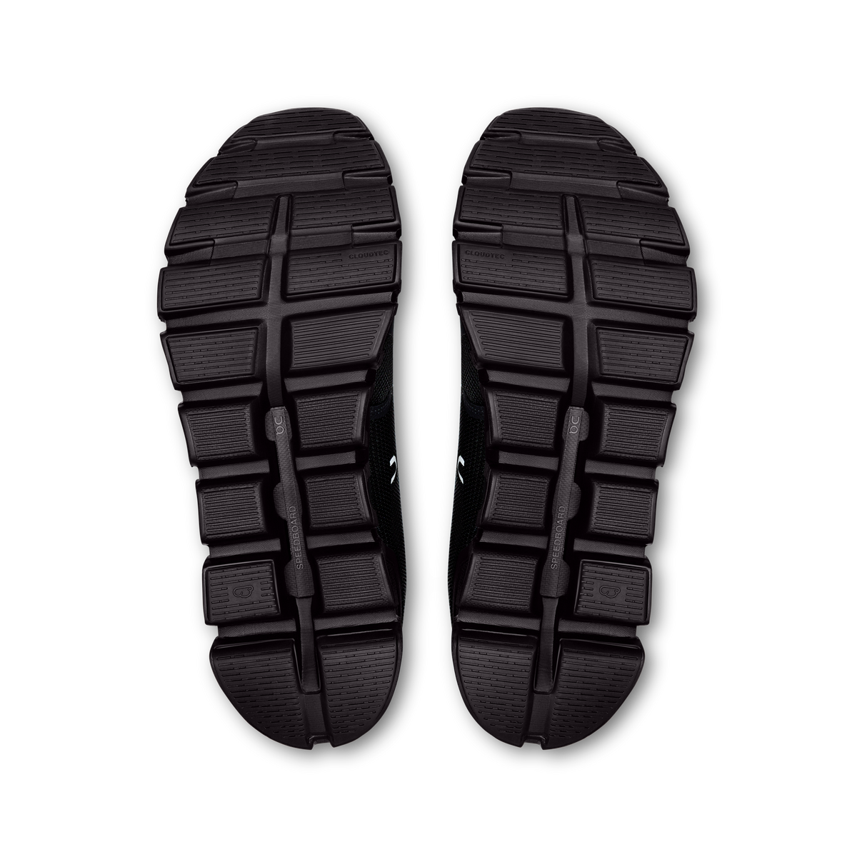 Pair of black shoe outsoles with deep tread pattern