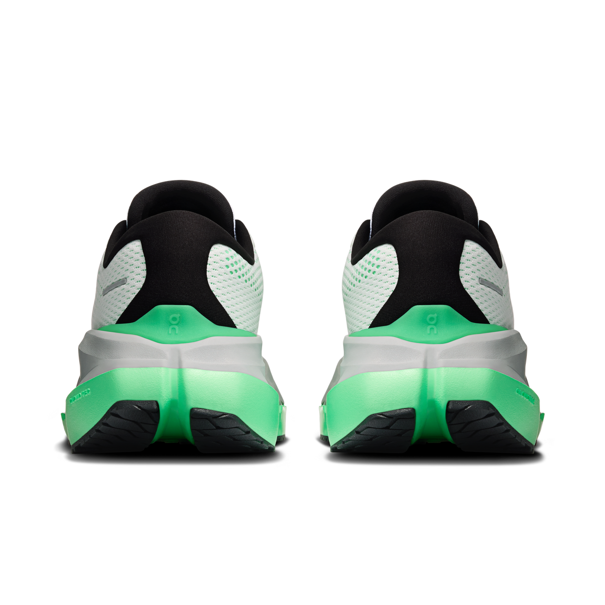 Shoe heel view: black collar and heel cup with white mesh and green midsole