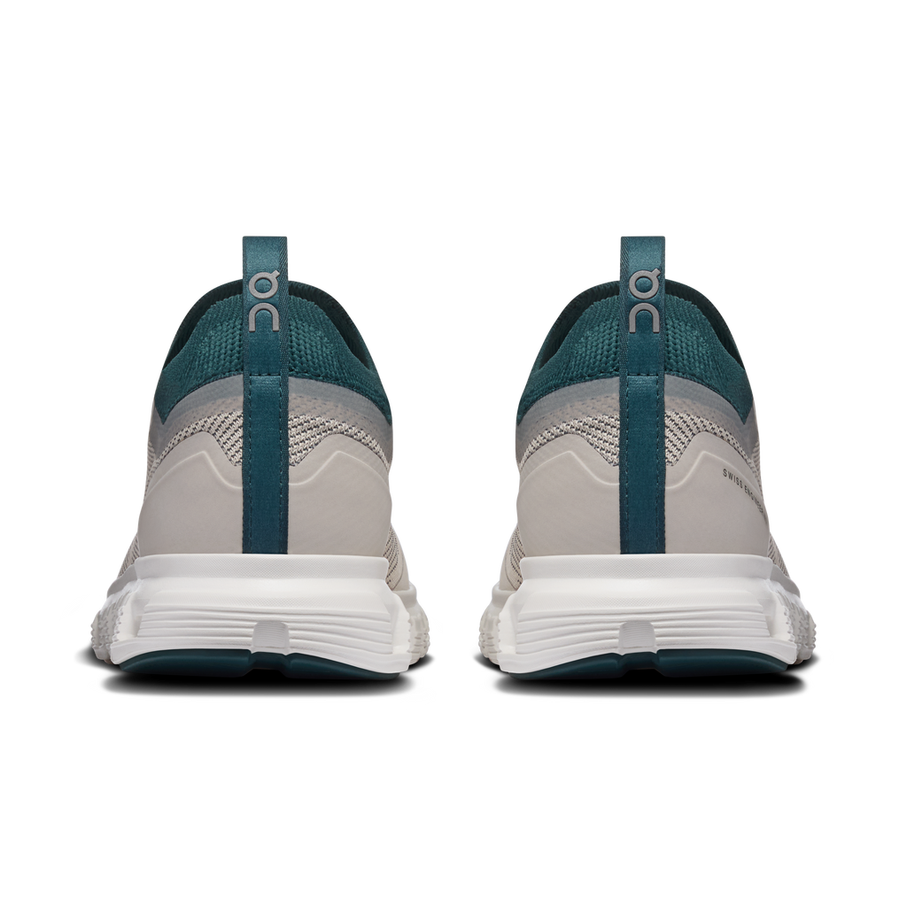 Women's running shoes, rear view with teal heel loop and padded white midsole.