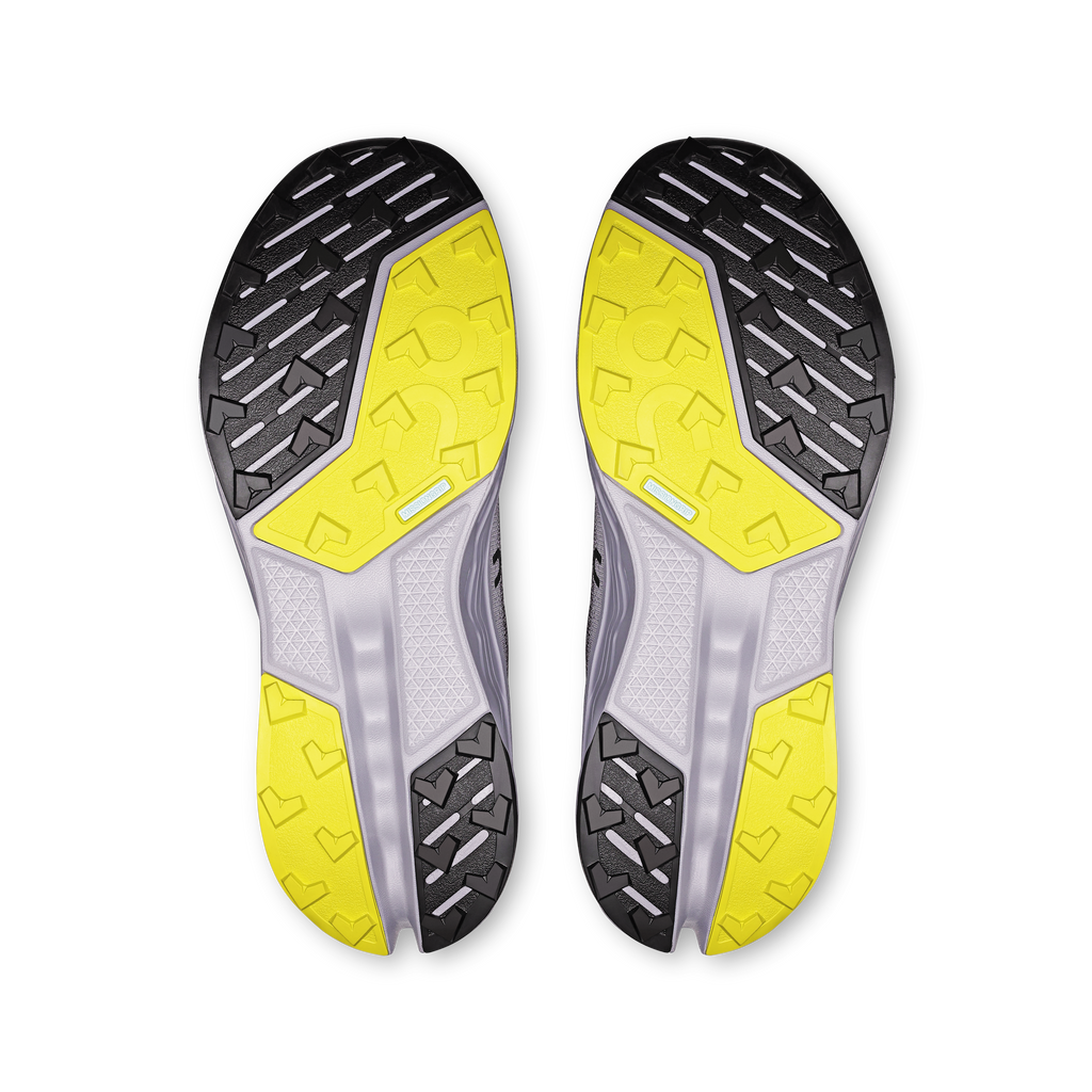 Women's trail running shoes outsole, black tread with bright yellow traction panels