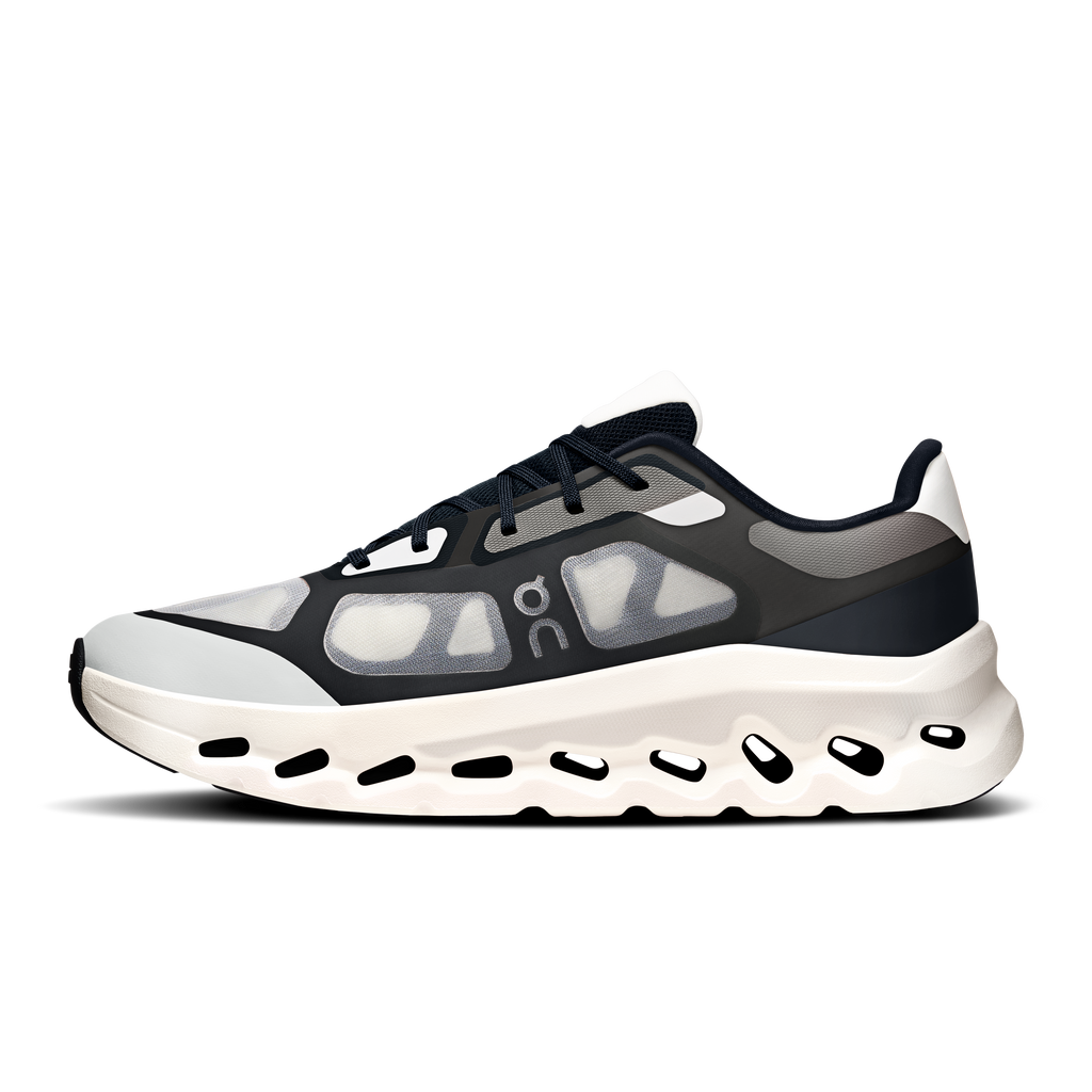 Men's black and ivory lace-up running shoe with graphic foam overlays and chunky sole