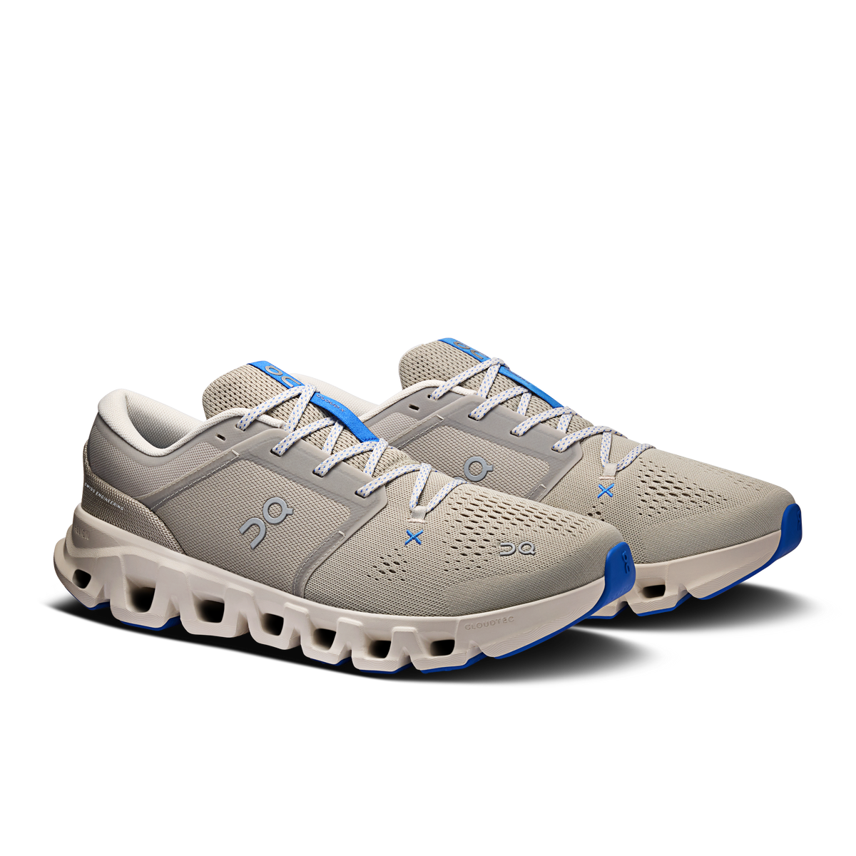 Men's lace-up running shoes in light gray with blue logo accents and chunky sole