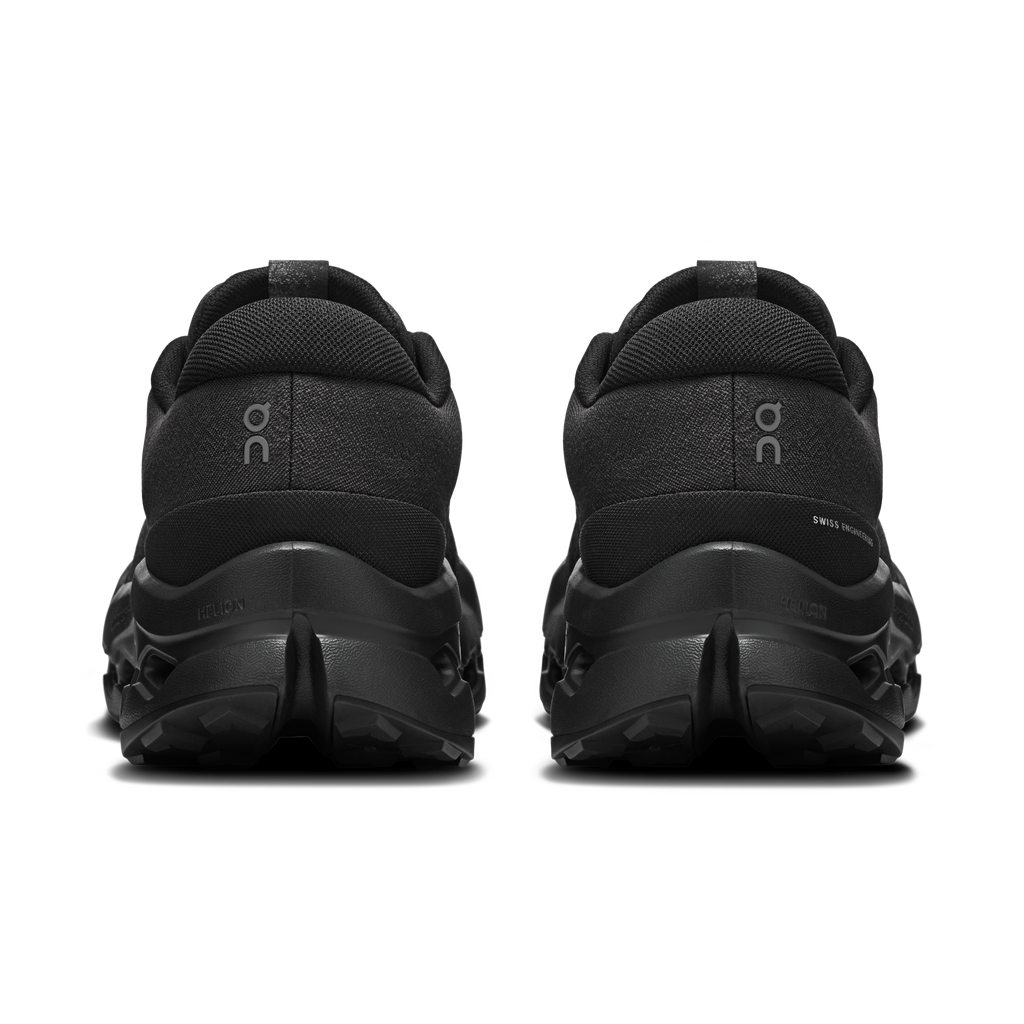 Men's black waterproof trail shoe rear view with heel pull tab and cushioned collar