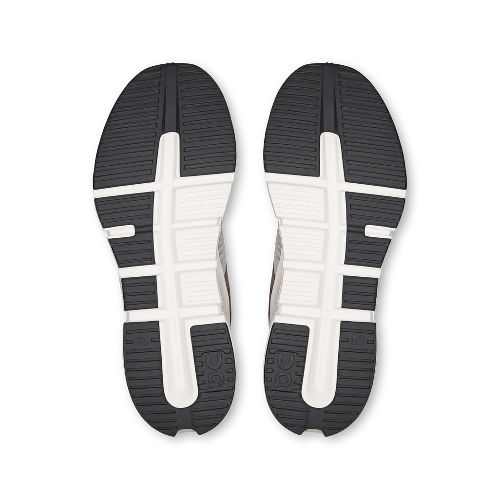 Shoe outsoles with dark rubber tread, white midsole and side traction grooves